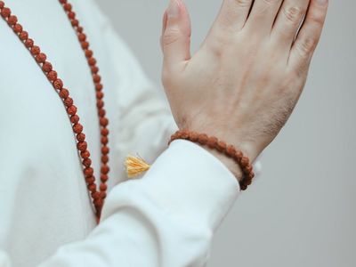Detail of hands in a meditative pose.